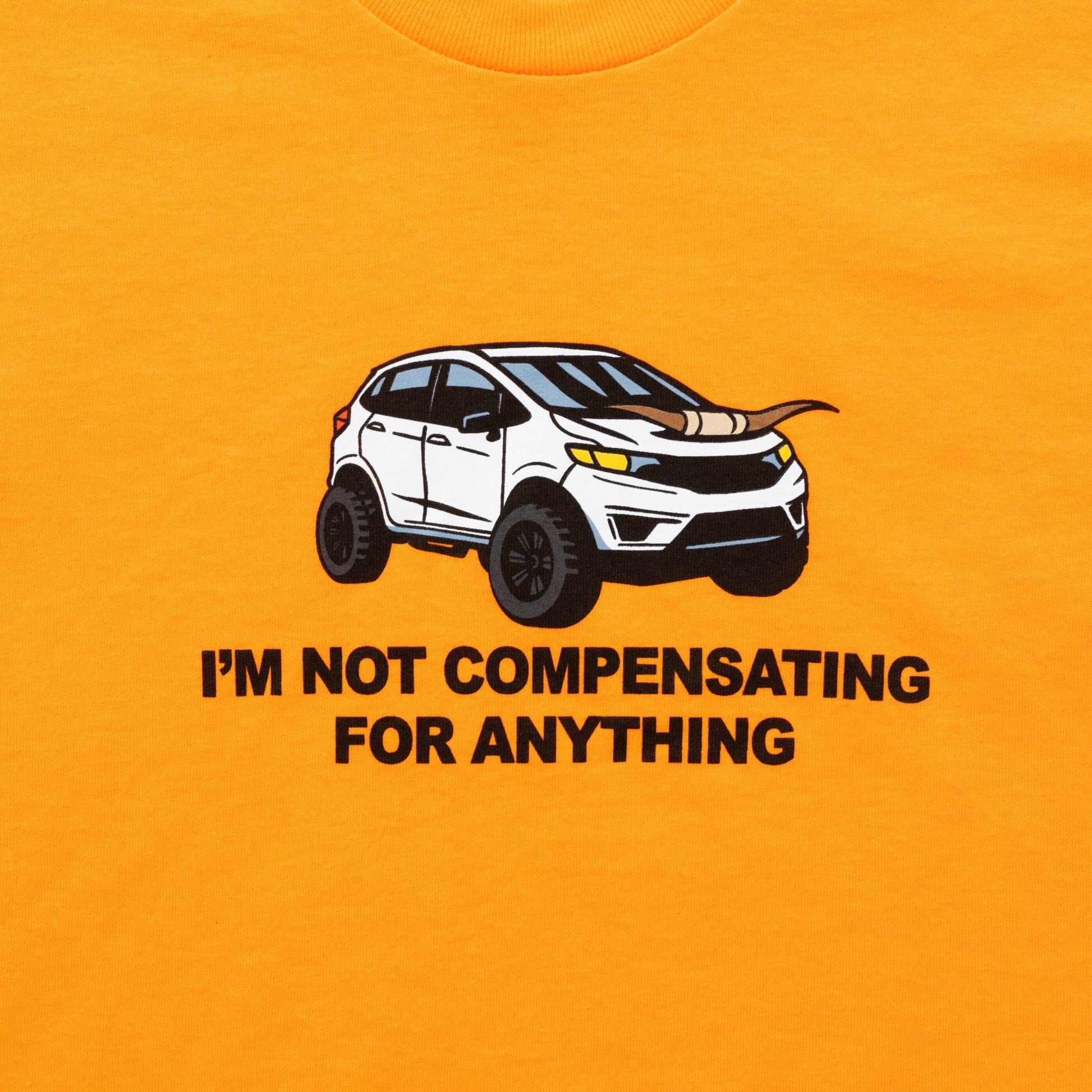 I'm Not Compensating Orange Tee - Danny Duncan